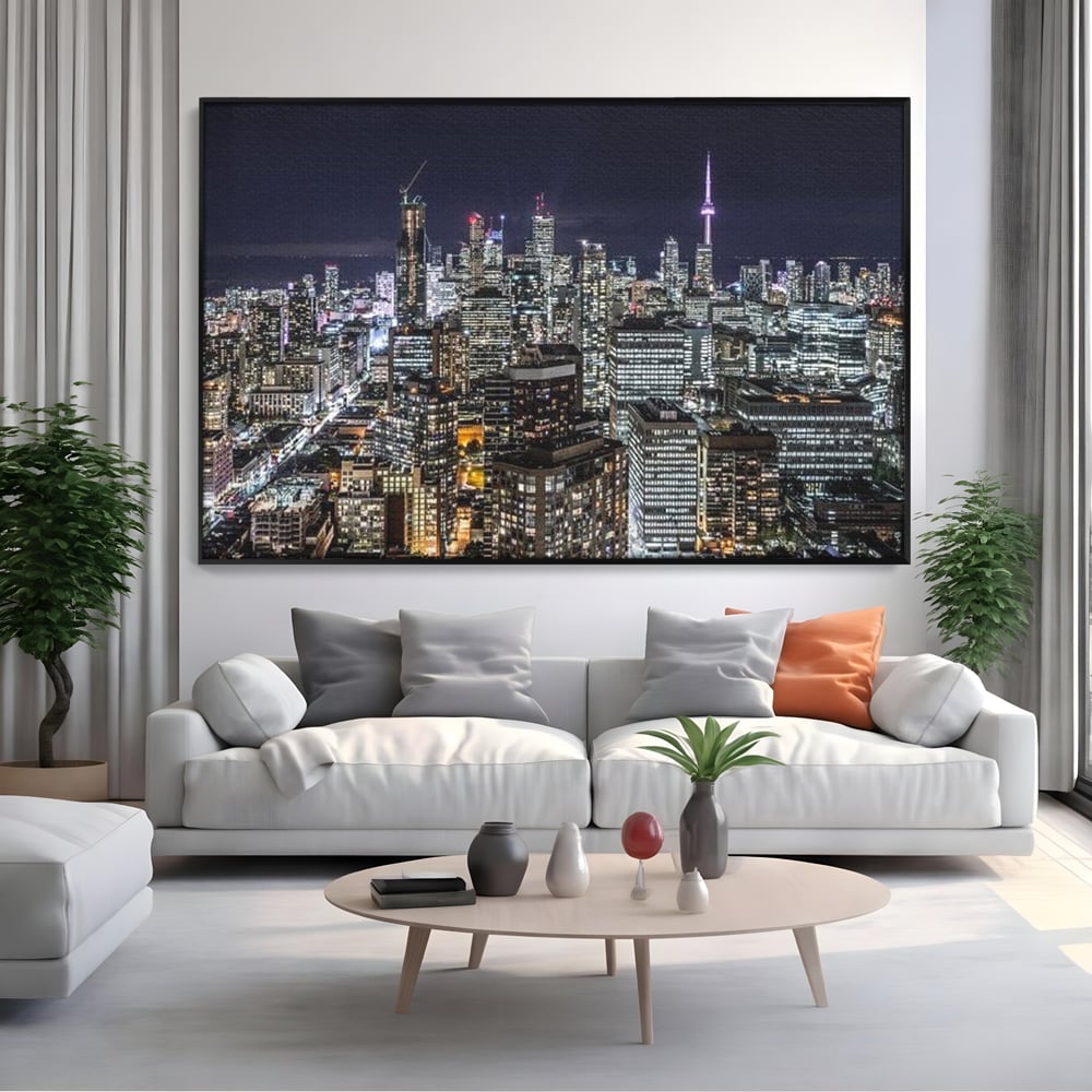 Tablou canvas cu panoramic nocturn cu toronto si cn tower, in rama de aluminiu negru, pe perete intr-un living